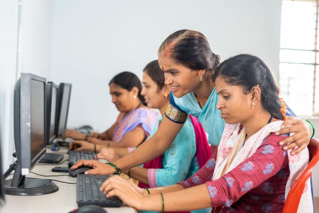 A group of students developing computer skills in a classroom environment.