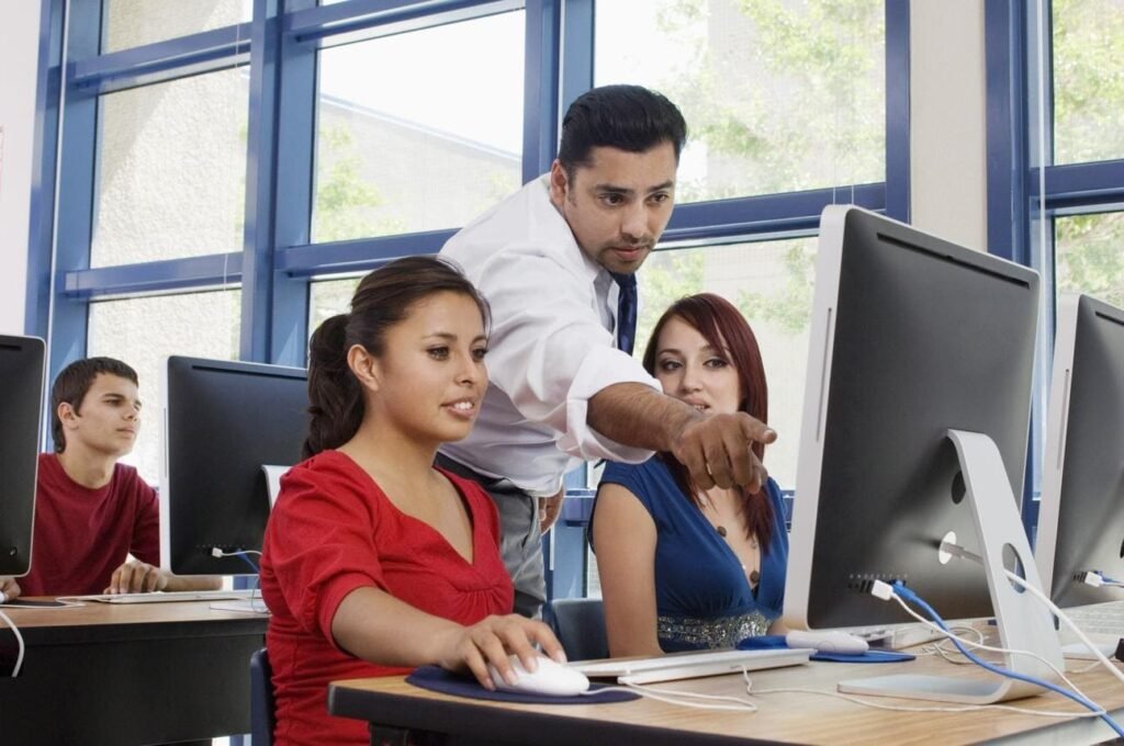 Students learning computer applications at a computer training institute in Madurai.